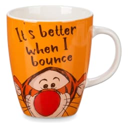 كوب سيراميك برتقالي واحد ببطانة ويد بيضاء، عليه رسمة شخصية كرتونية وعبارة 'It's better when I bounce'. - view 1