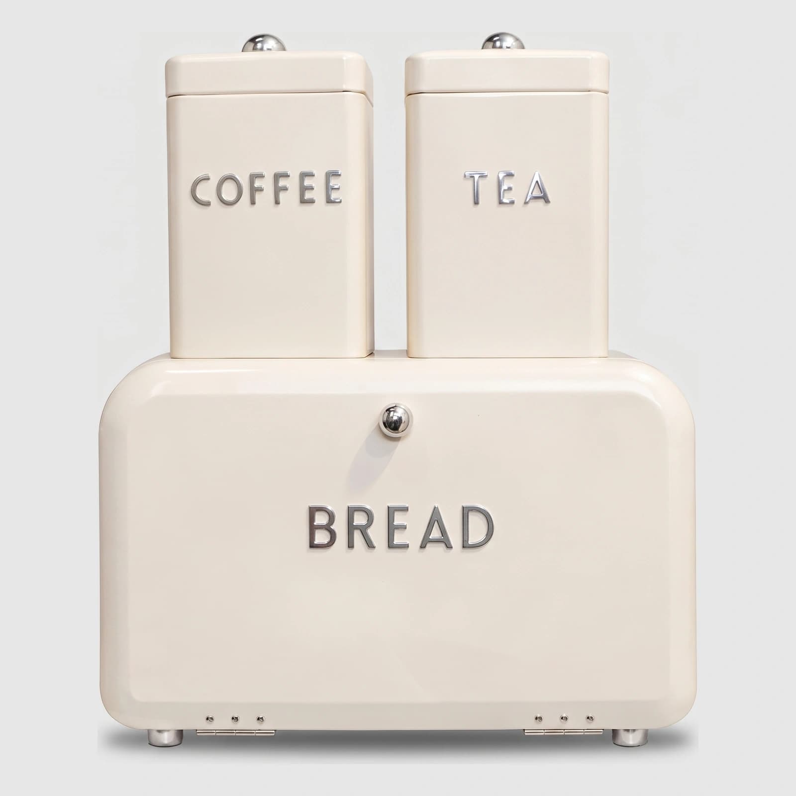 صندوق خبز معدني كريمي مع برطمانين معدن كريمي متطابقين مكتوب عليهم "COFFEE" و "TEA" من فوق، على خلفية بيضاء.